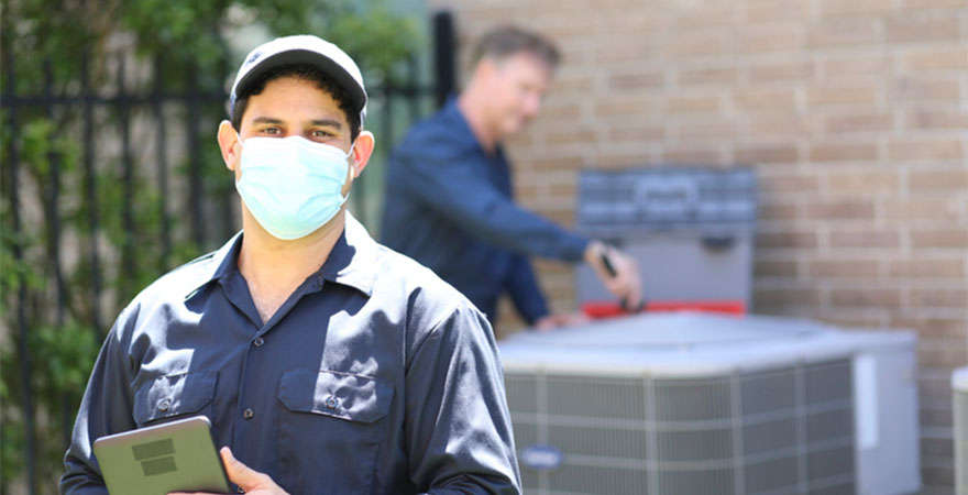 AC Repair Contractor Outside with Mask at Grosse Pointe Home