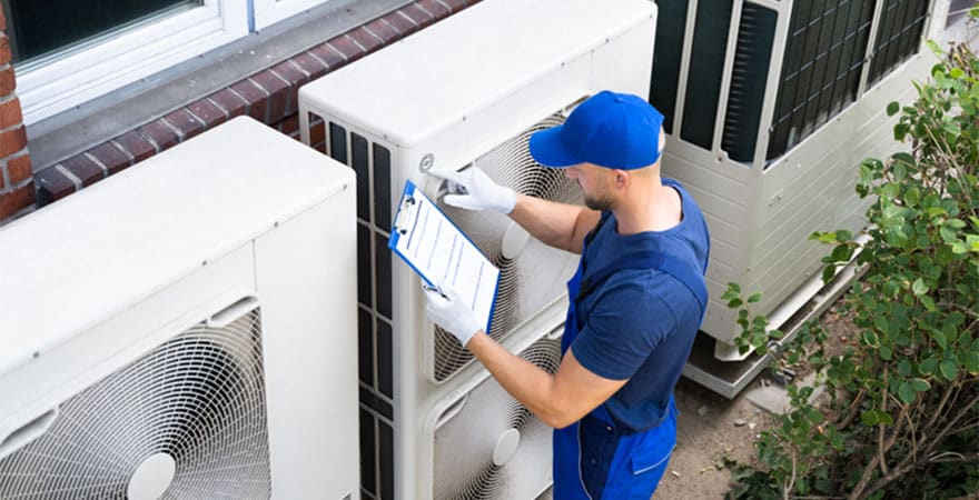Air Conditioning Contractor Inspecting Unit